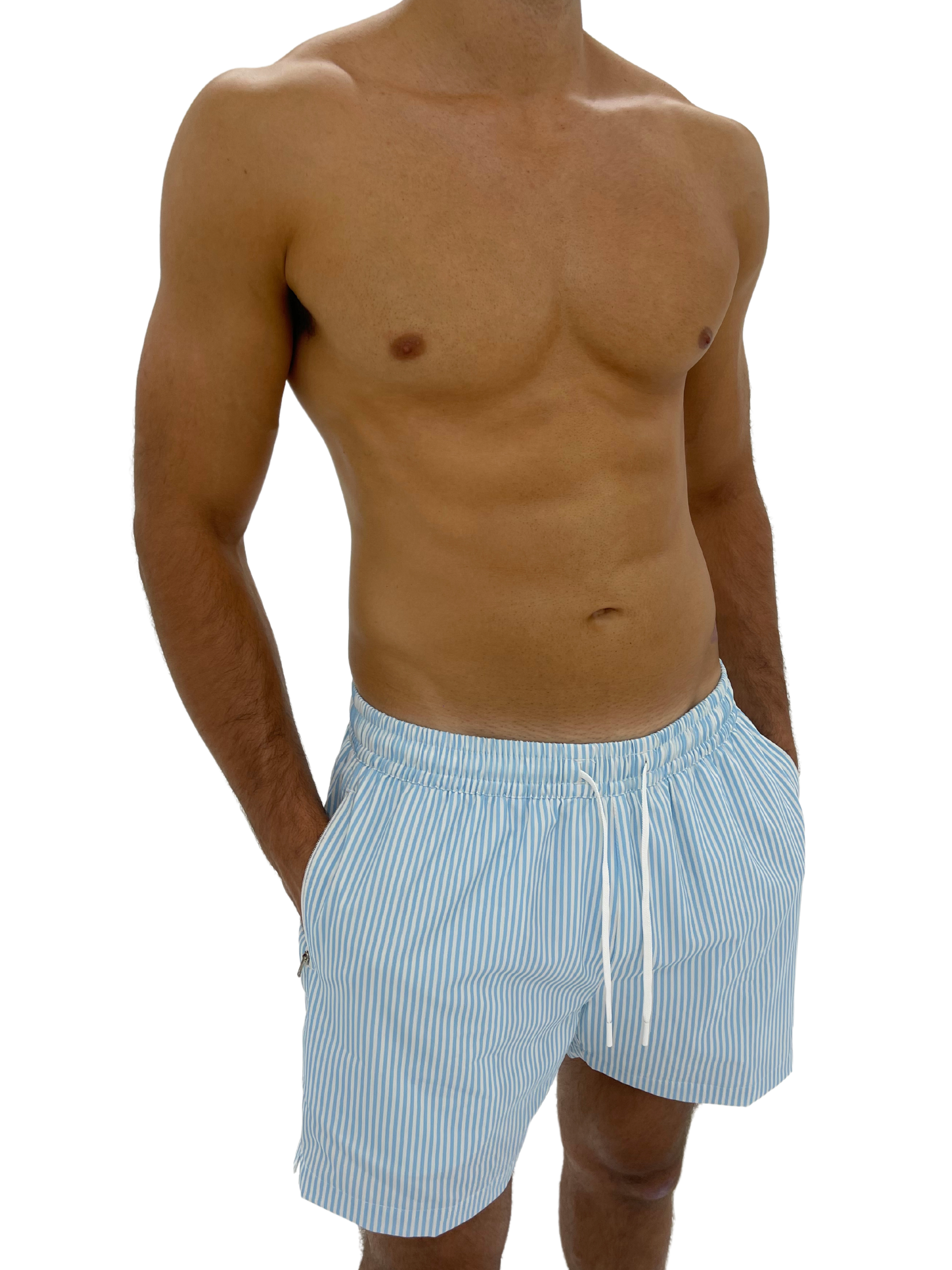 Hoekey light blue striped men’s swim shorts with quick-dry fabric, adjustable white drawstring, and side zippered pockets for comfort and functionality.