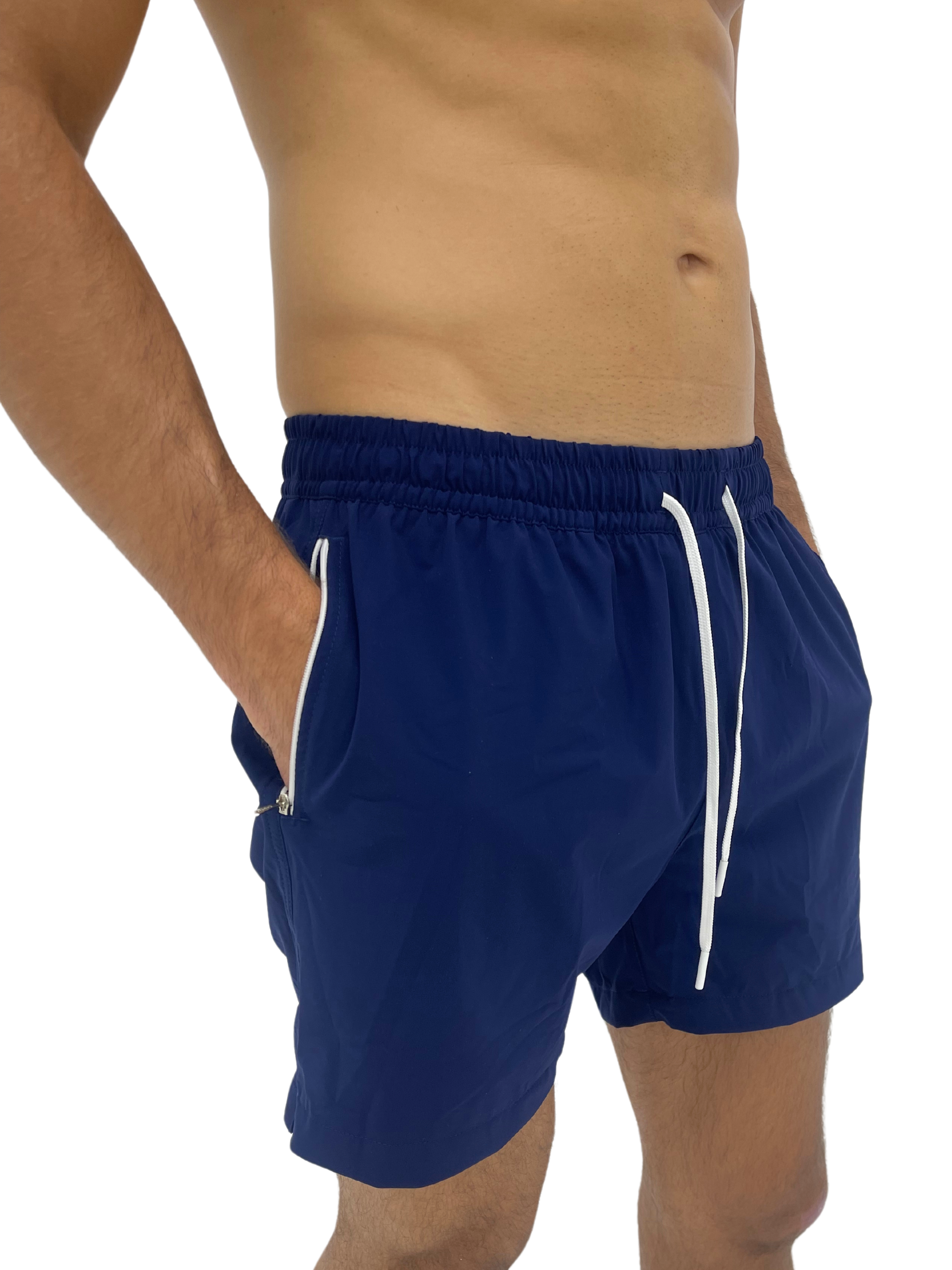 Hoekey navy men’s swim shorts with quick-dry fabric, adjustable white drawstring, and secure zippered pockets for functionality and style.