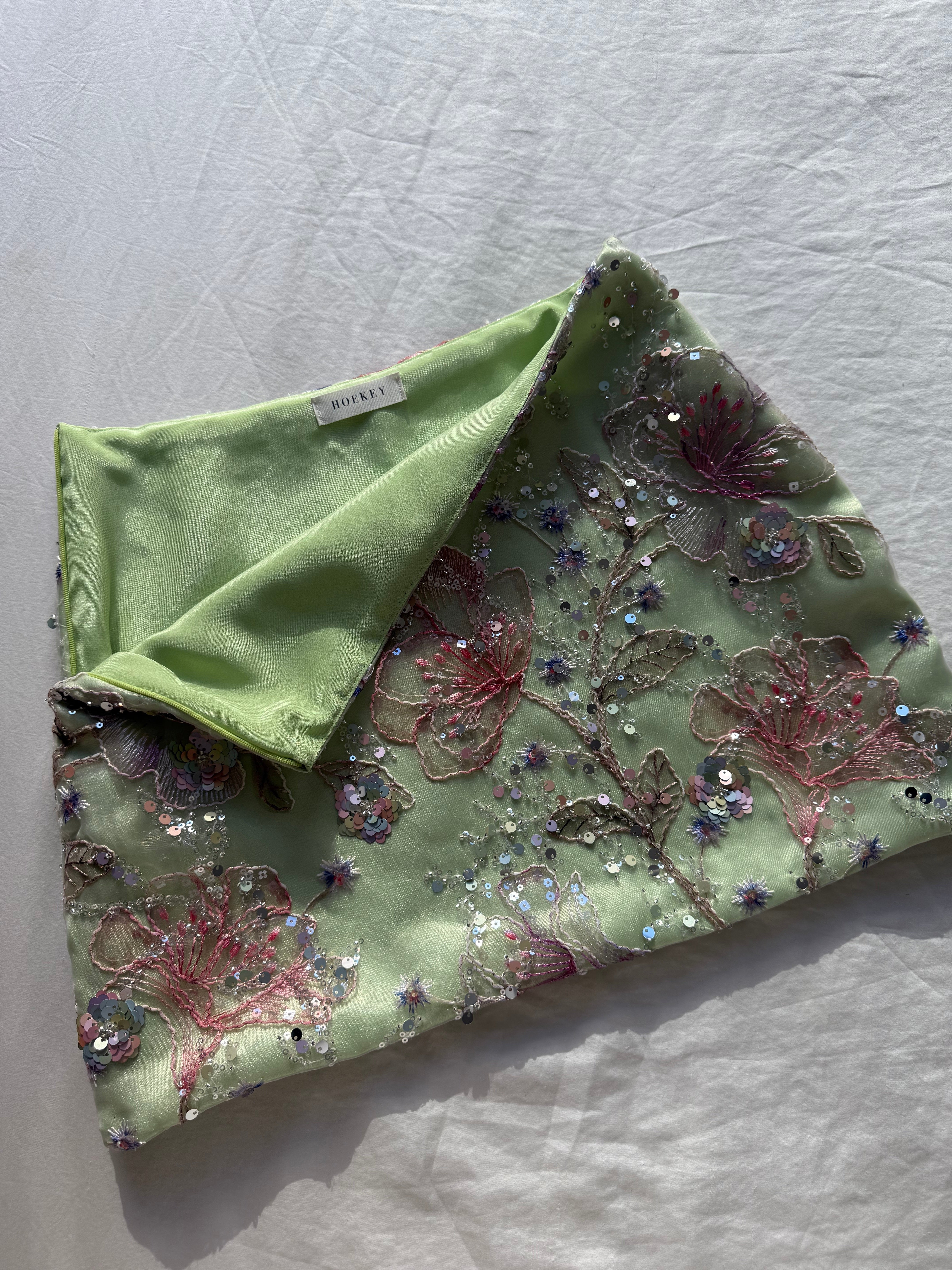 Hoekey pastel green floral embroidered mini skirt with sequins, featuring a soft satin lining and detailed appliqué for a polished, high-quality finish.