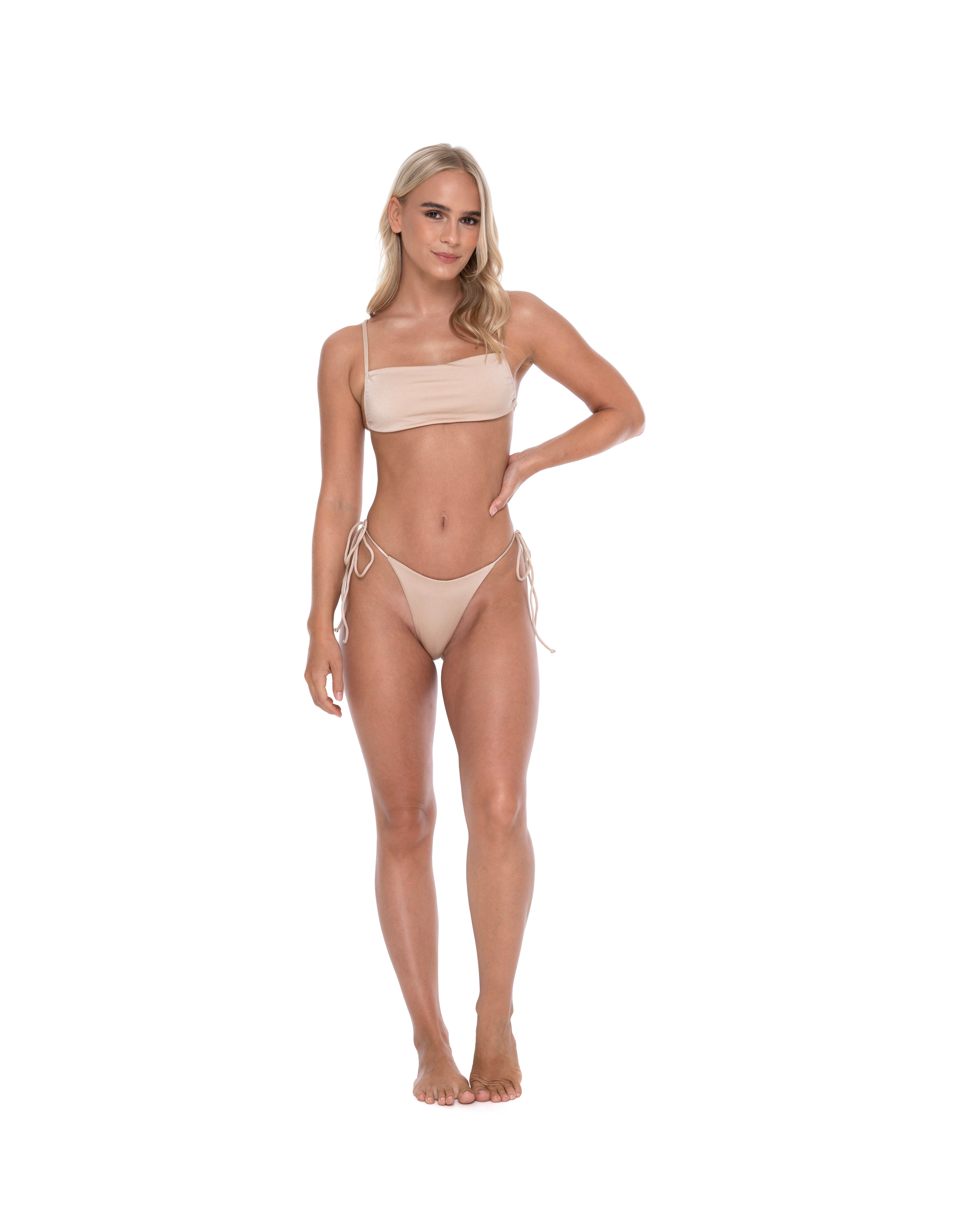 Hoekey beige bandeau bikini with side tie bottoms stylish women’s swimwear pose.
