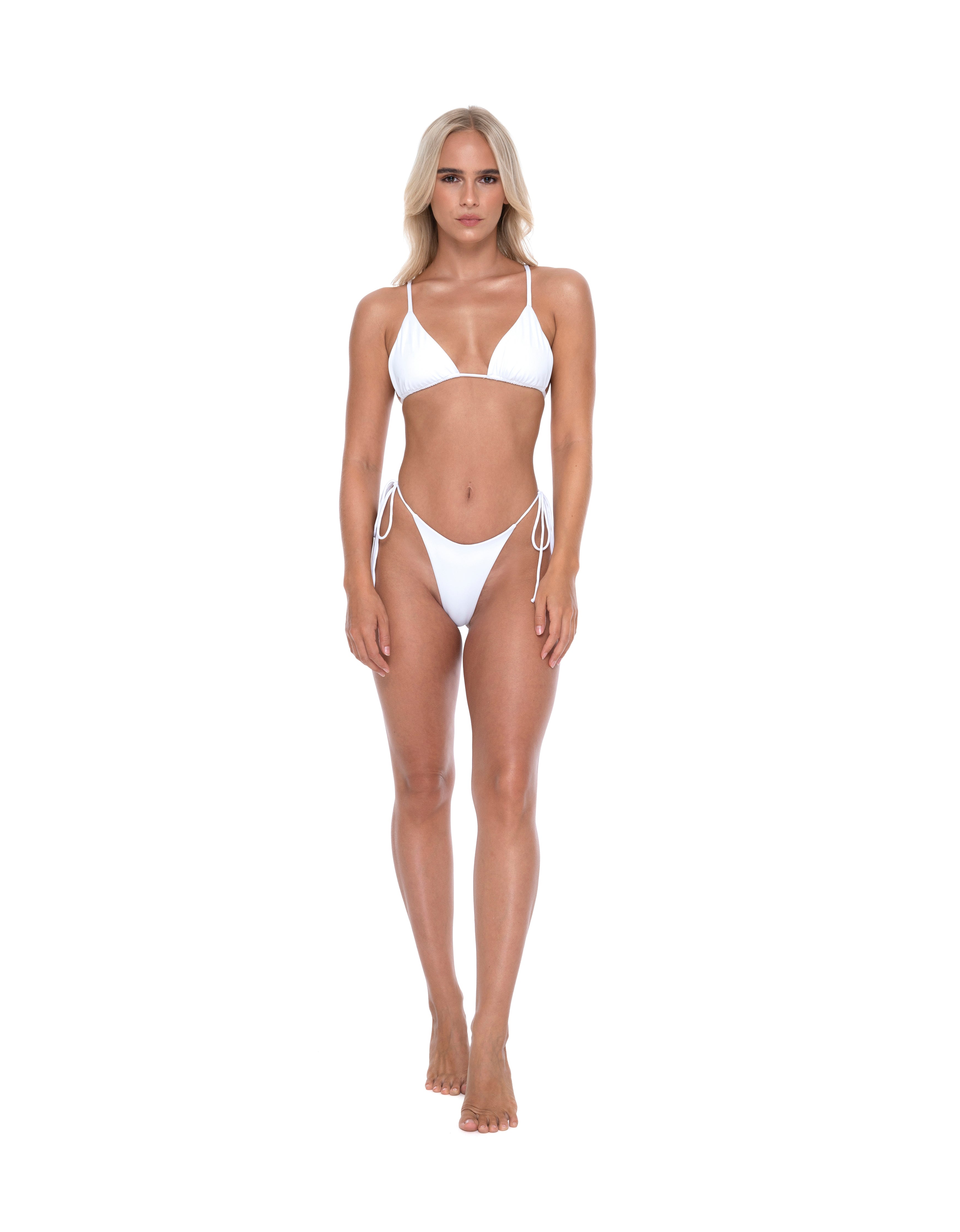 Front view of woman wearing a white triangle string bikini from Hoekey, featuring adjustable halter top and tie side bottoms.